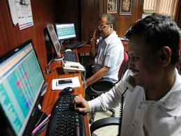Sensex ends at record high as financial stocks lead