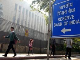 RBI keeps interest rates on hold, lowers inflation projection