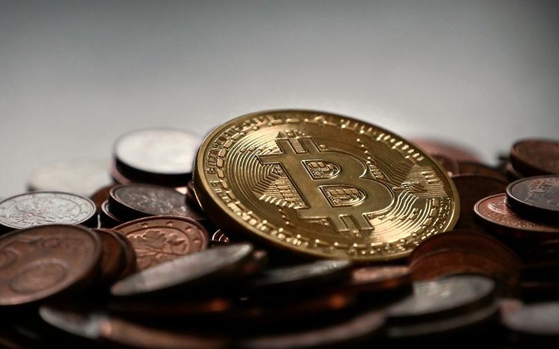 Bitcoin soars to new record near $8,000 on talk of split
