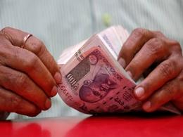 India's current account surplus shrinks in July-September