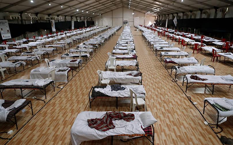 Record rise in India virus cases raises fear of return of curbs