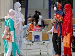 India extends record rise in COVID-19 cases, election rallies continue
