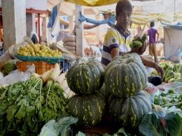 Markets end flat in volatile session ahead of inflation data