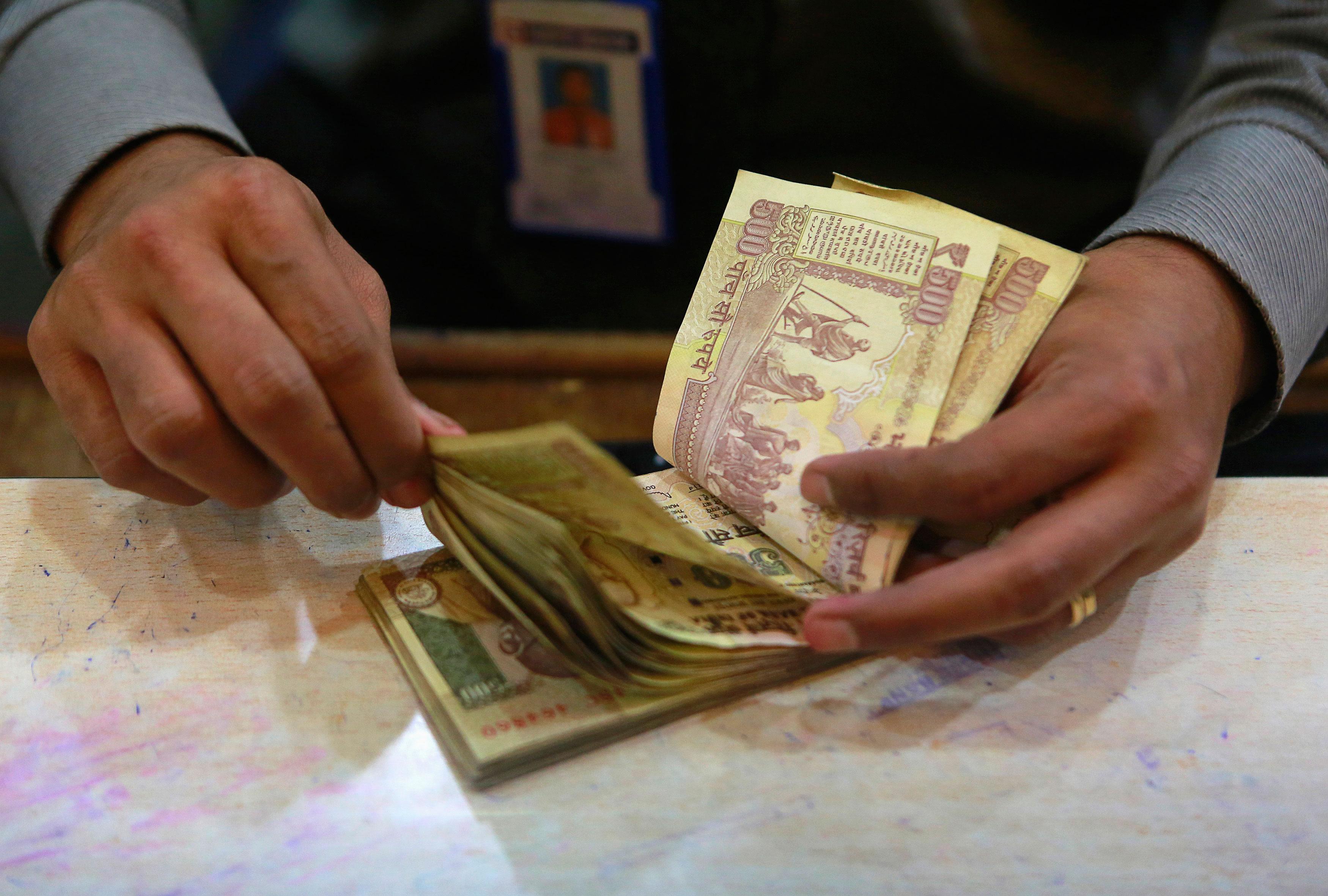 Rupee dips to 13-month low Vs US dollar