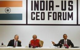 Modi promises predictable tax regime; Obama raises IPR issues