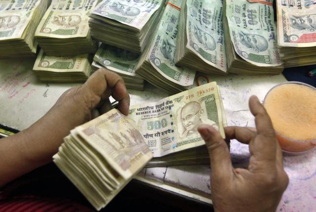 Rupee hits 20-month low, ends at 64 against US dollar