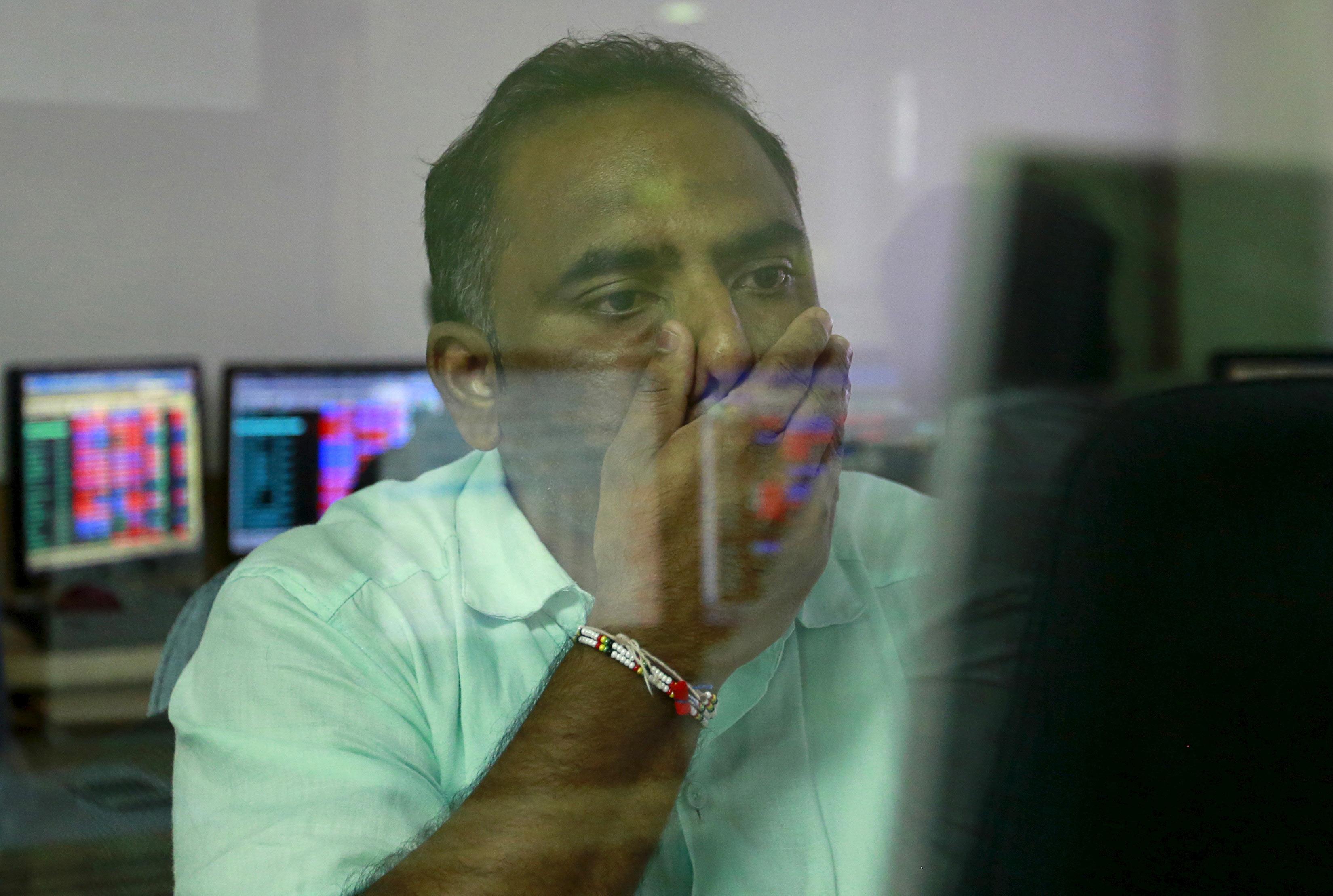 Sensex closes below 25,000; rupee slides