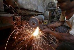 India manufacturing output edges up in May