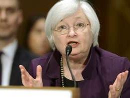 US Fed keeps rates on hold, hints at hike later