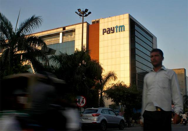What prompted Paytm to roll back 2% fee on wallet top-up via credit cards?