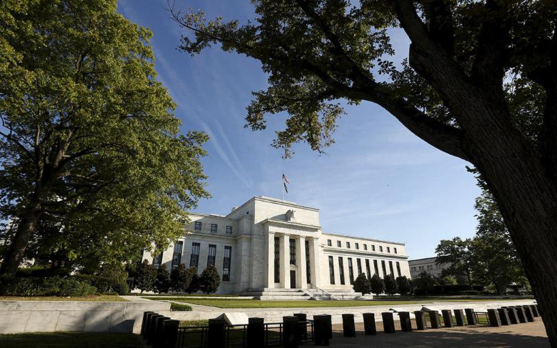 Fed signals higher rates in 2023, bond-buying taper talks as virus fades