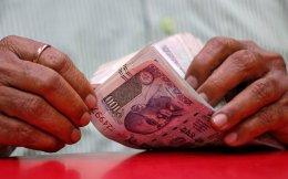 India's current account surplus shrinks in July-September