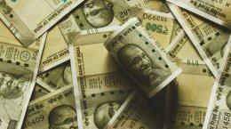 Rupee ends at record low as crude prices rise on geopolitical concerns